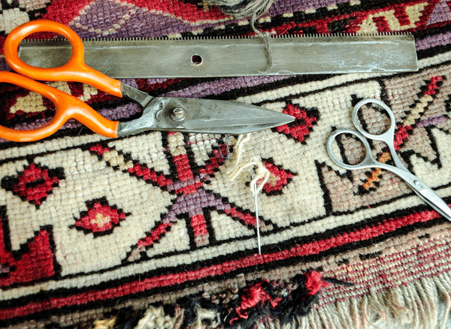 close up of rug restoration tools, scissors, needle, etc. for area rug repair - Decatur, IL