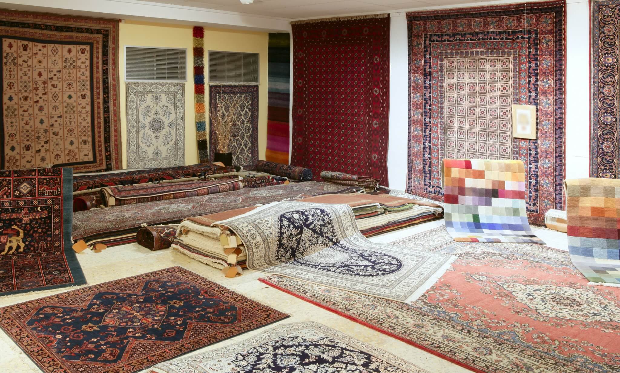 Variety of carpets/ Persian carpets and rugs on display in shop - Lincoln, IL