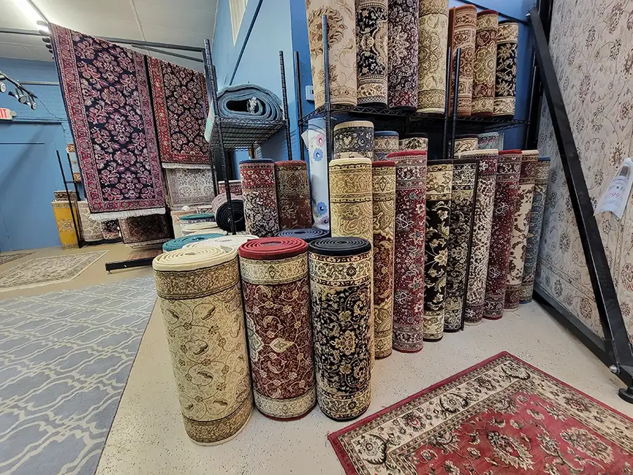 Rug Rack & Murphy Rug Cleaners - Variety of hall/runner rugs on display in shop - Springfield, IL