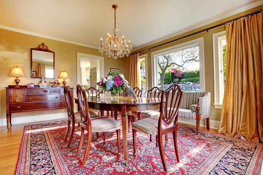 A beautiful oriental rug adds color and warmth to this dining room in Springfield, IL, without cluttering the space.